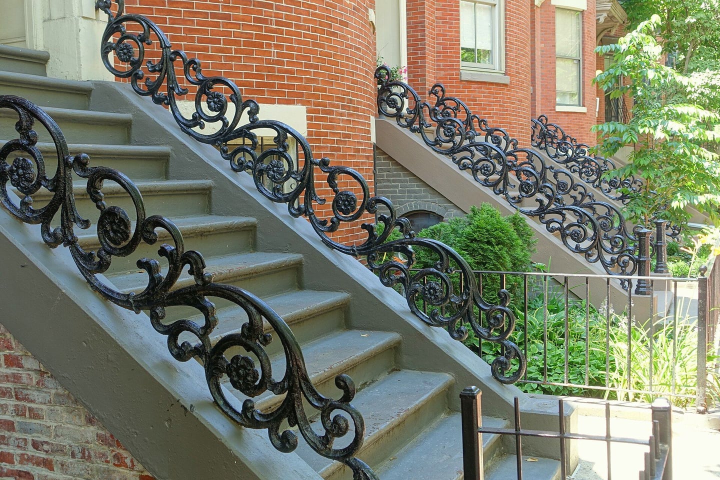 Stone front steps and wrought-iron railings on Boston’s Concord Square